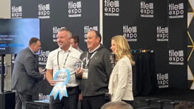 Best of TISE Award presentation giving Fifth Gear Technologies the StonExpo Disruptor Award