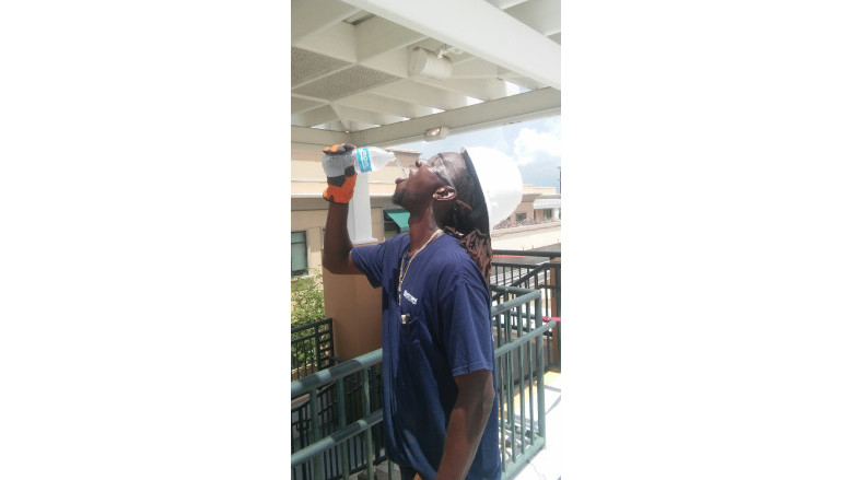 Western Worker Staying Hydrated in Heat .jpg